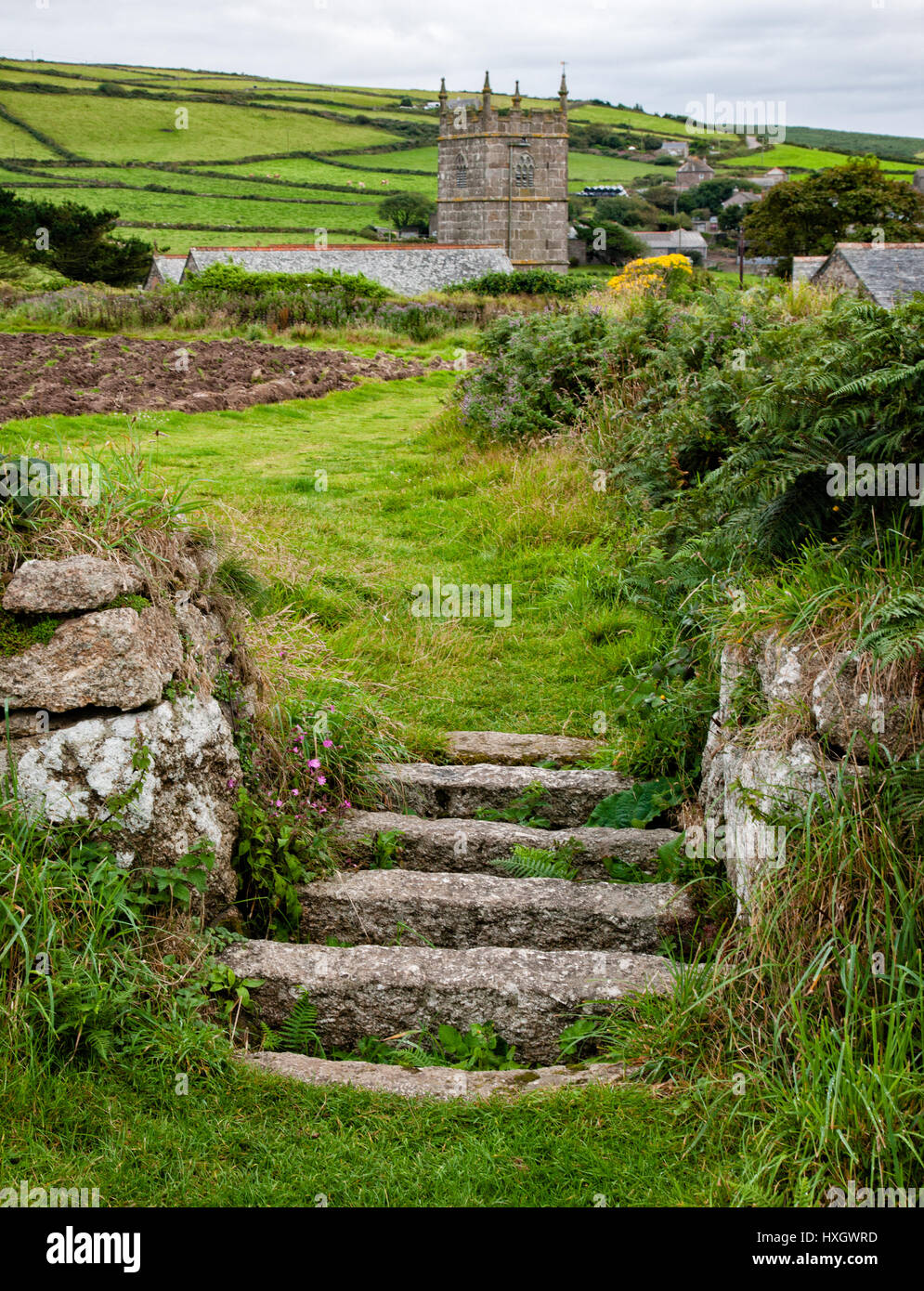 Field boundary stile made of large granite slabs forming a giant stone cattle grid near the village of Zennor on the coast of West Penwith Cornwall Stock Photo