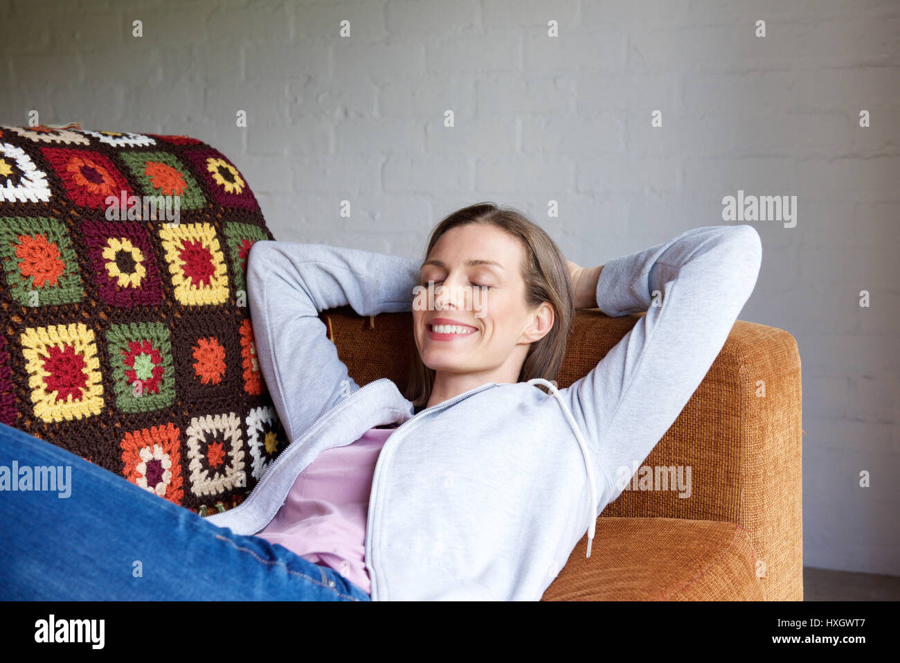 Portrait of a smiling older woman relaxing at home Stock Photo - Alamy