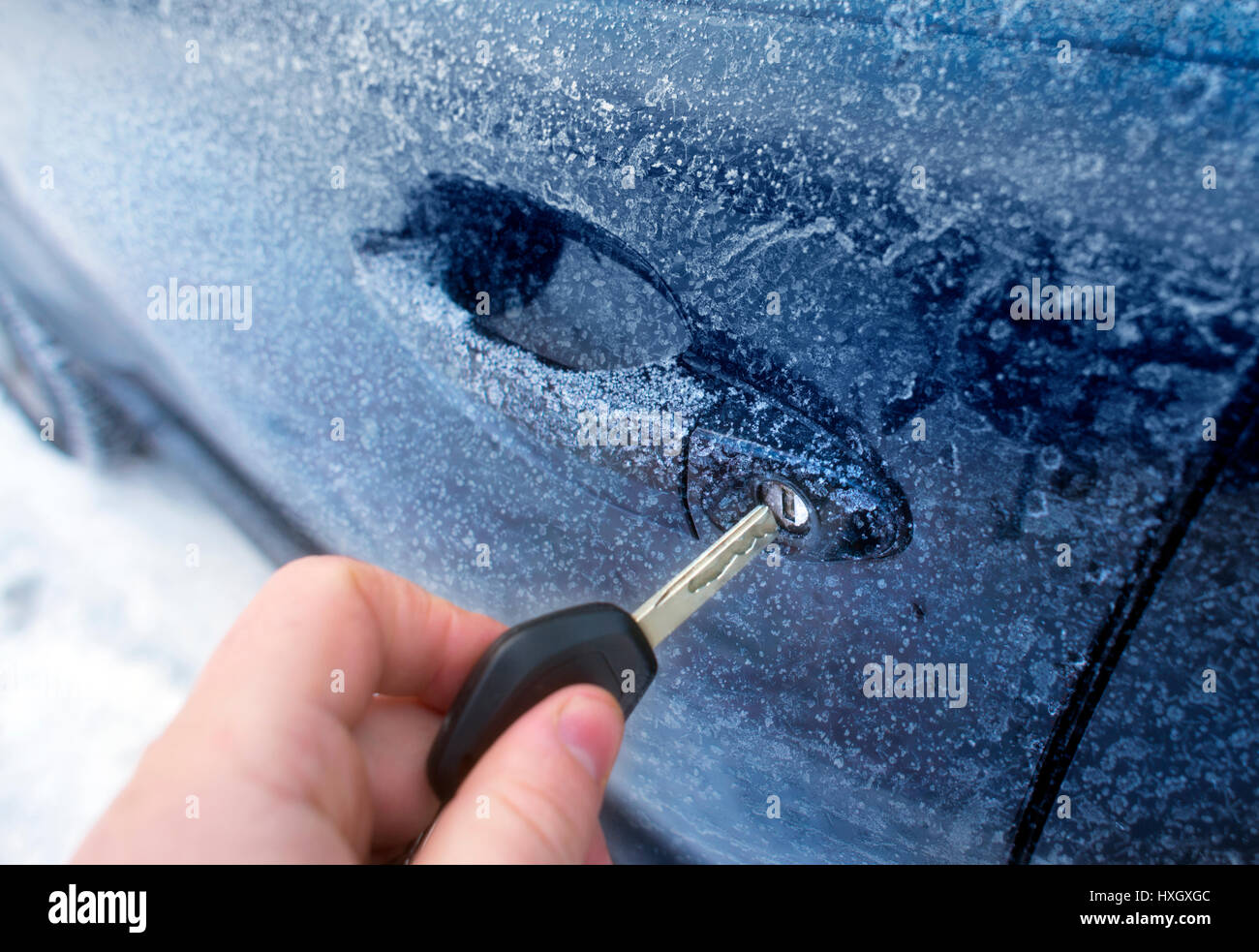 Unlocking A Car Door On A Cold Frozen Winter Morning Stock