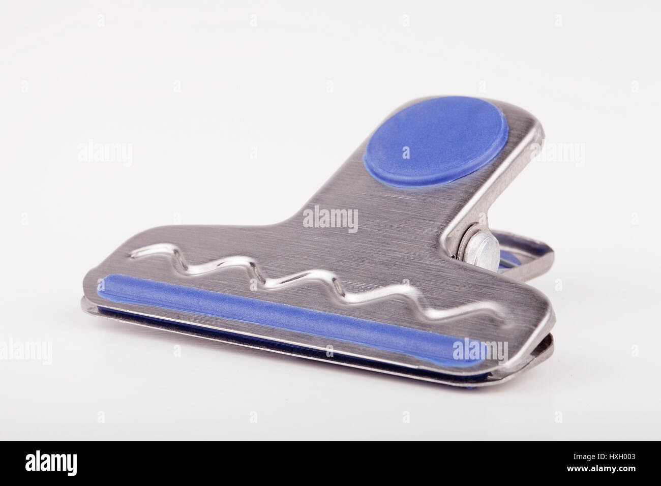 paper clip on a white surface. Paperclip isolated on white