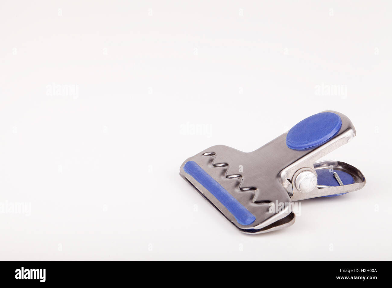 paper clip on a white surface. Paperclip isolated on white