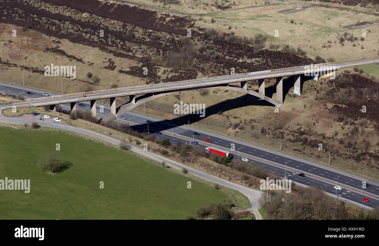aerial view of the Saddleworth Road arched bridge over the M62 in the Pennines, UK Stock Photo