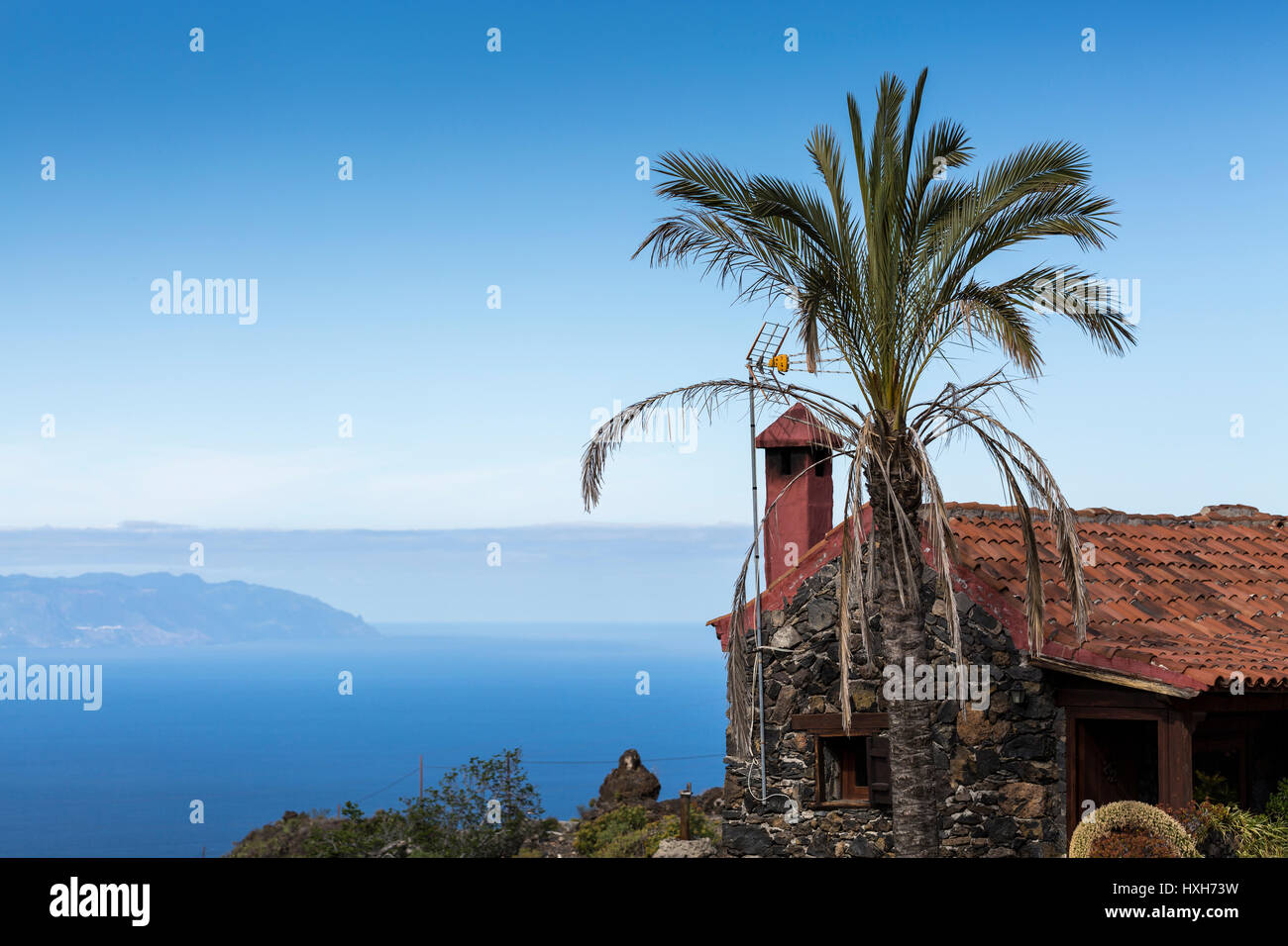 Typical stone built house in the hills of Guia de Isora near Aripe, with panoramic views out to the island of La gomera, Tenerife, Canary Islands, Spa Stock Photo