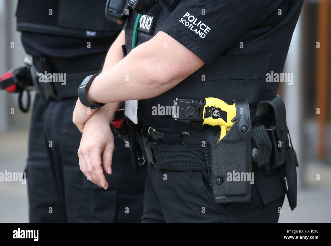 Police officers with Tasers outside Scottish Parliament in Edinburgh ...