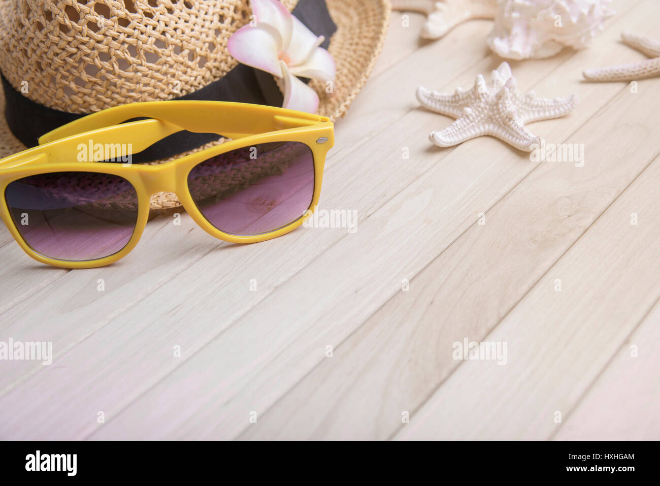 Straw hat and sunglasses on wooden boards. Summer still life Stock ...