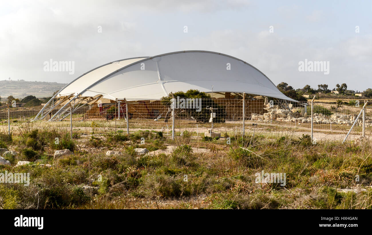 Ħaġar Qim megalithic complex showing the protective structure built in 2009. Malta. Stock Photo