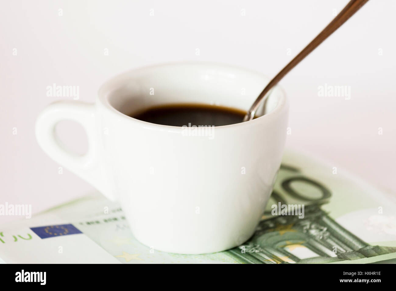 Coffee cup on money Stock Photo