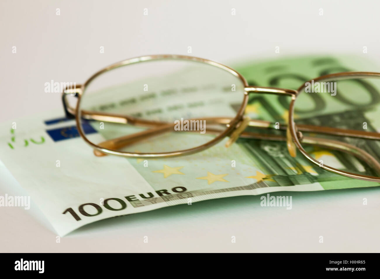 Money and eye glasses Stock Photo