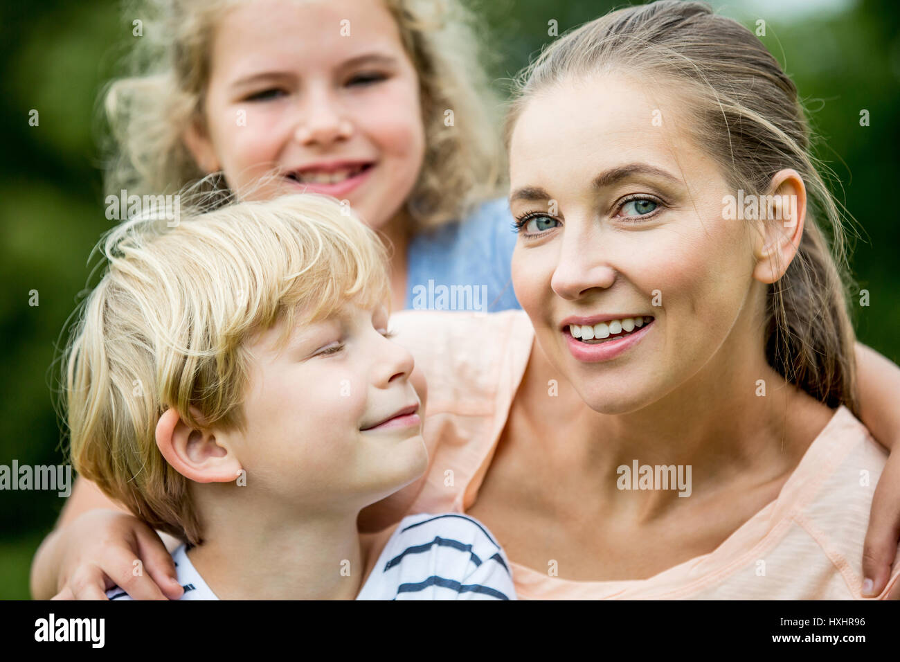 Woman as happy mother with children as family Stock Photo