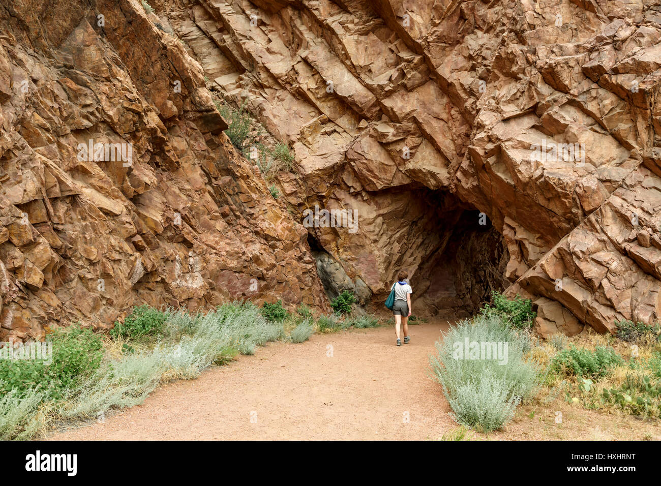 Woman hiker and rock tunnel, Tunnel Drive Trail, Canon City, Colorado USA Stock Photo