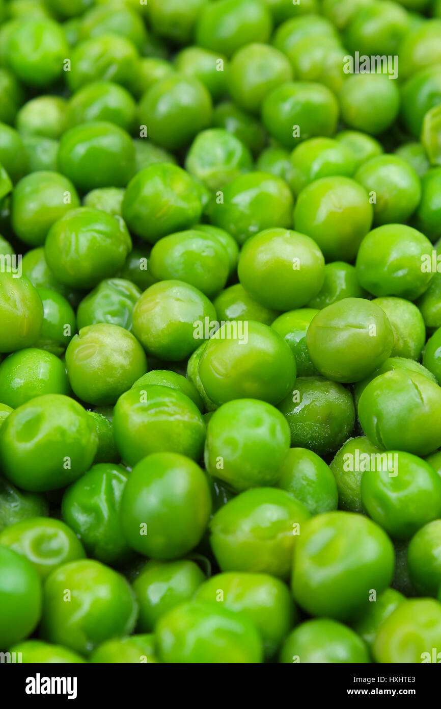 Frozen pea peases texture background. Green pease background pattern