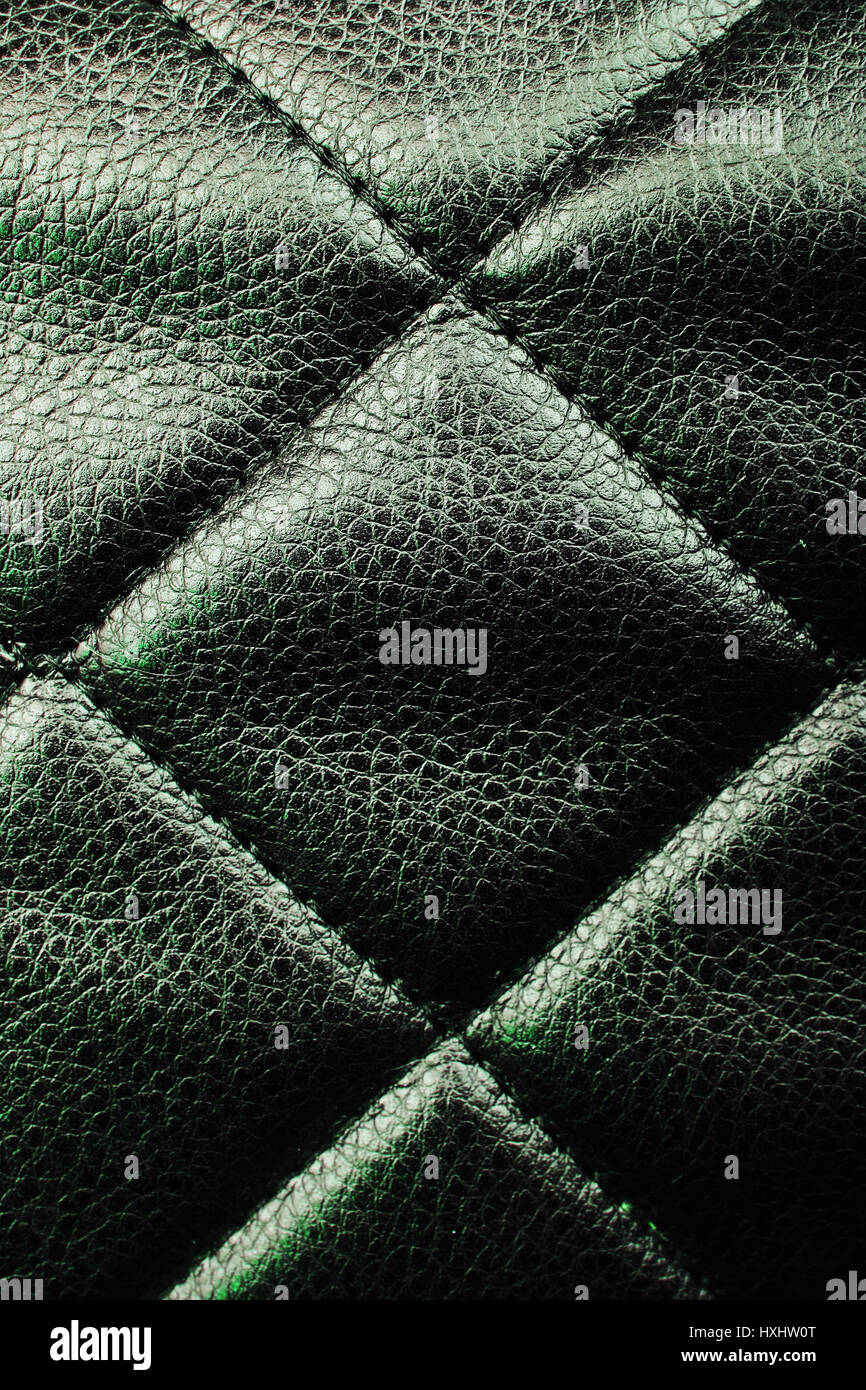 Bag material leather faux leather texture. Quilted pattern as background, Creased creasy fabric. Stock Photo