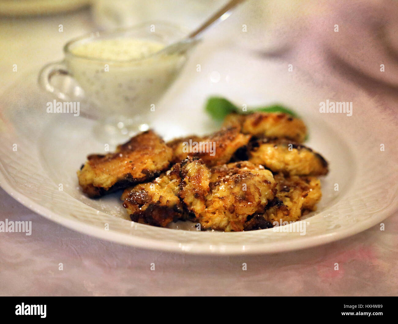 Delicious Apple fritters with sour cream to photograph closeup Stock Photo