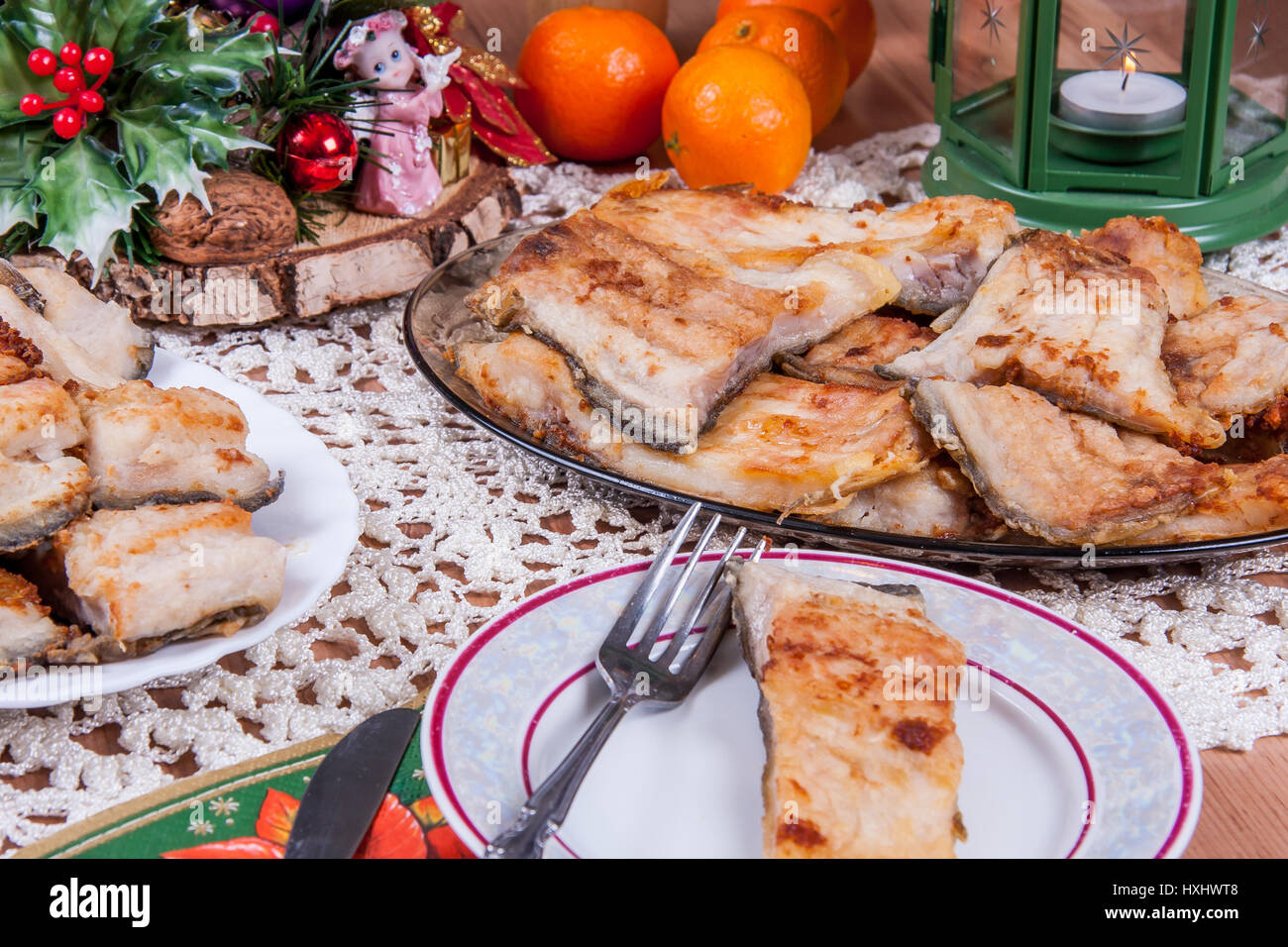 Fried carp -  traditional Polish Christmas Eve dishes on the table Stock Photo