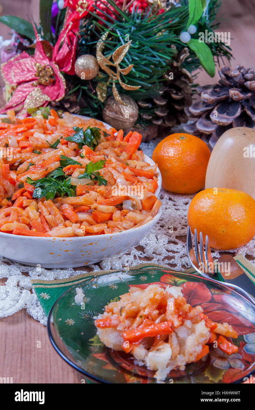 Fish, the Greek style.  A traditional Polish Christmas dish on a table. Stock Photo