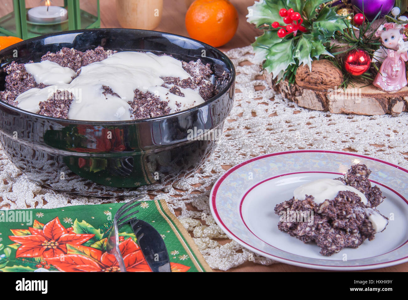 Poppy seeds with almonds and honey cream topping. A traditional Polish Christmas dish on a table Stock Photo