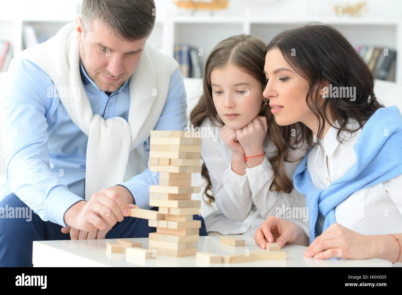 Family with daughter playing a game Stock Photo