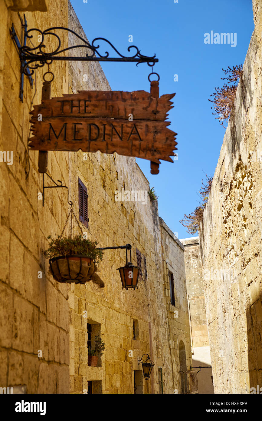 MDINA, MALTA - JULY 29, 2015: The signboard of the restaurant “Medina” on the street of the old Malta capital Mdina. Stock Photo
