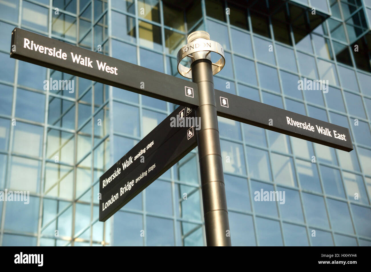 London, UK, November, 4 2007 : Street signpost giving east and west directions to the Thames Path Riverside Walk Stock Photo