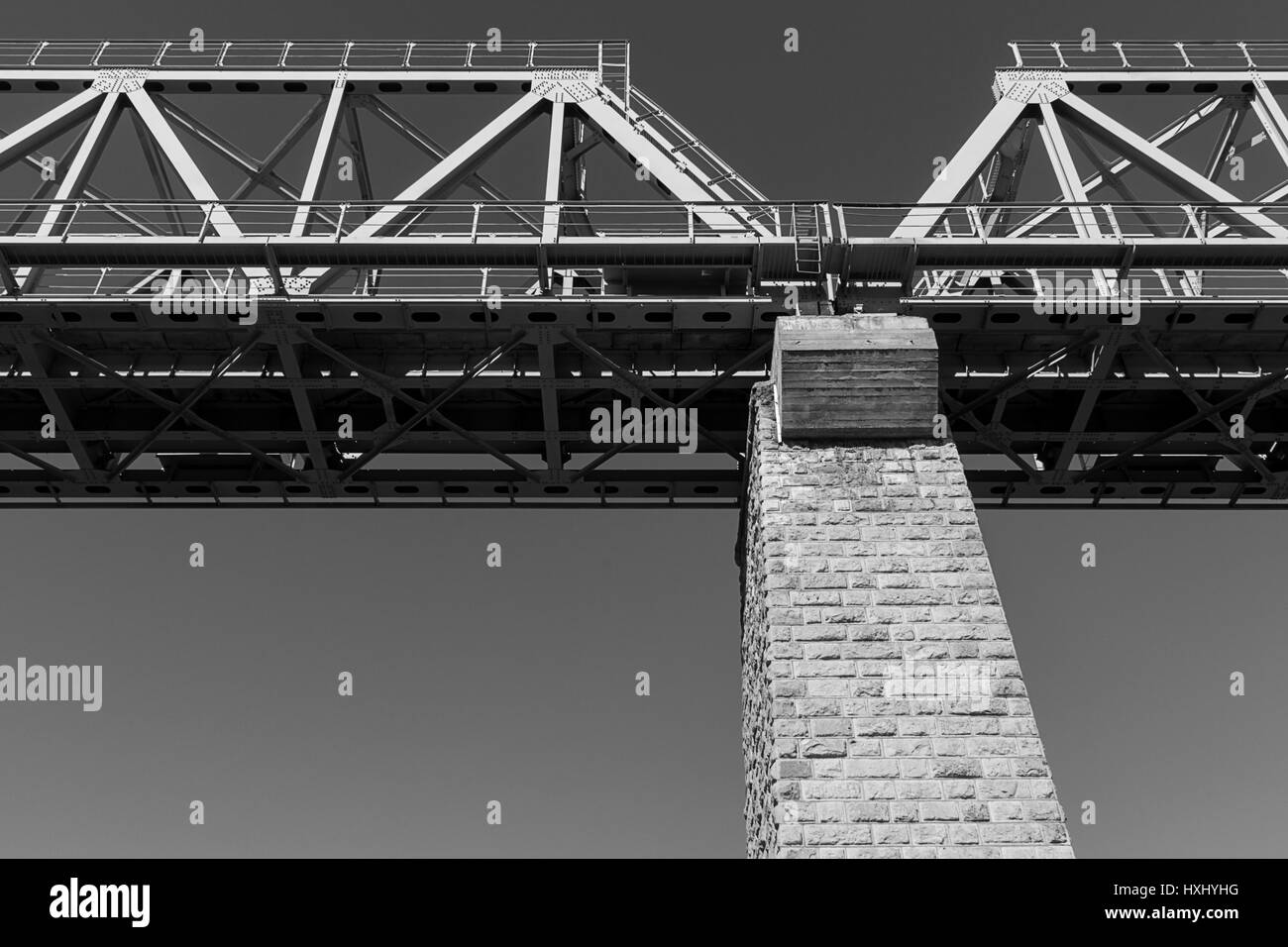 Inside view of big steel railway bridge on sunrise. Savonlinna, Finland Stock Photo