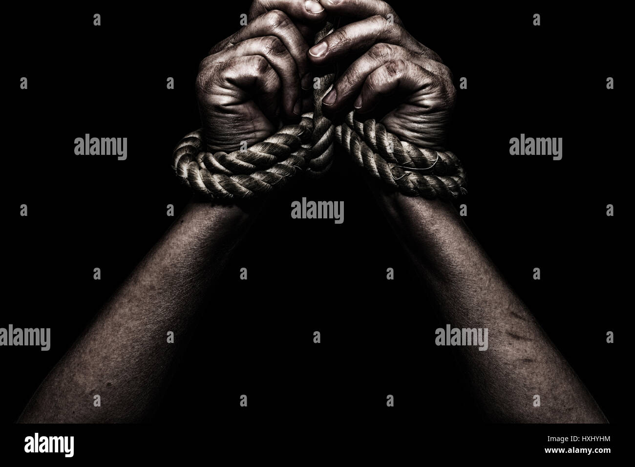 woman hands bound prisoner in room,hands bound Stock Photo