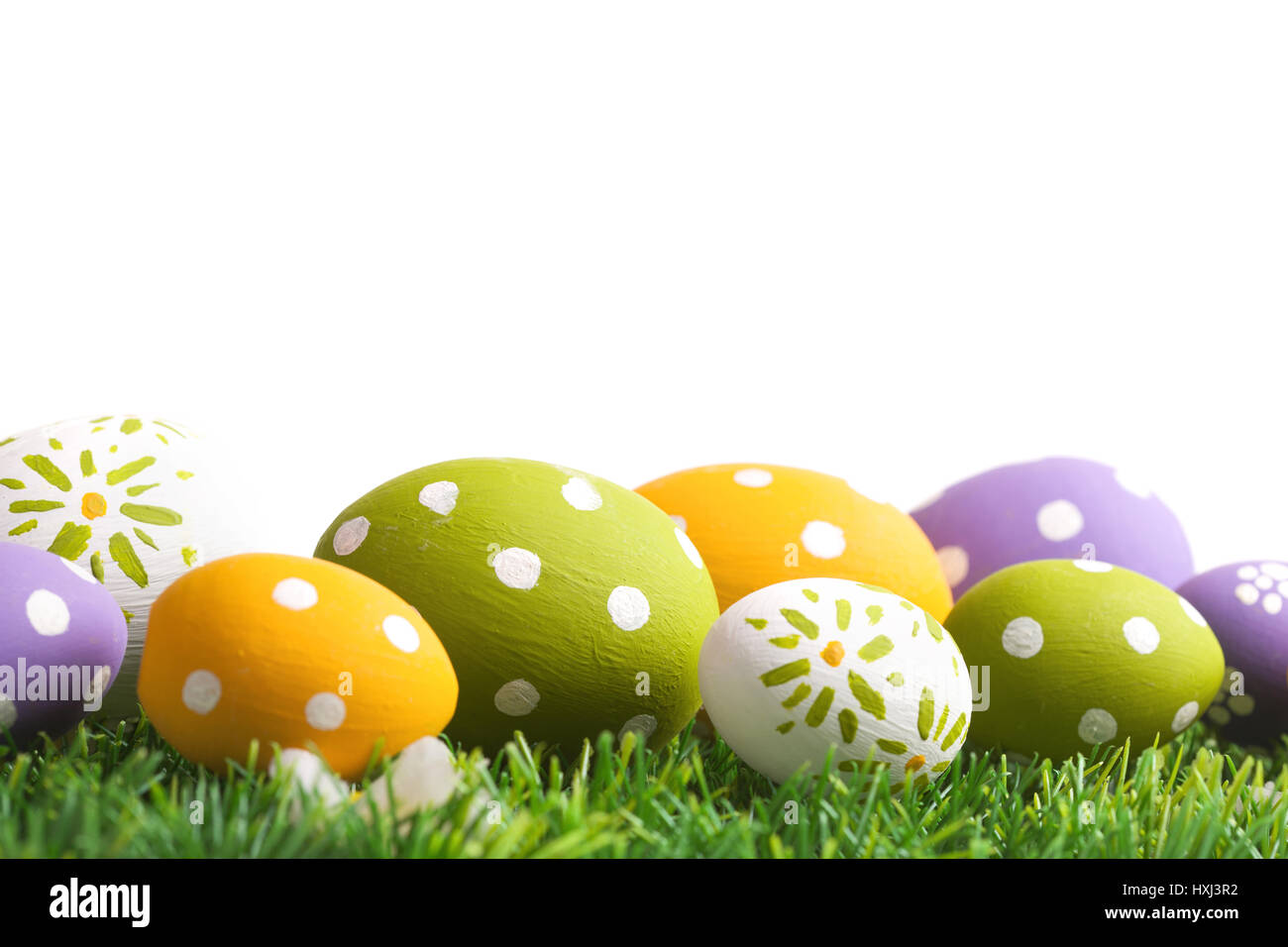 Colorful eggs and green grass Stock Photo