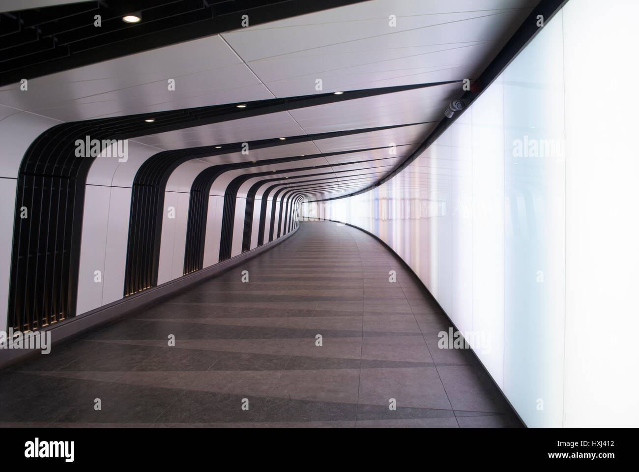 Pedestrian tunnel with integrated light wall in King's Cross Station, designed by Allies & Morrison Stock Photo