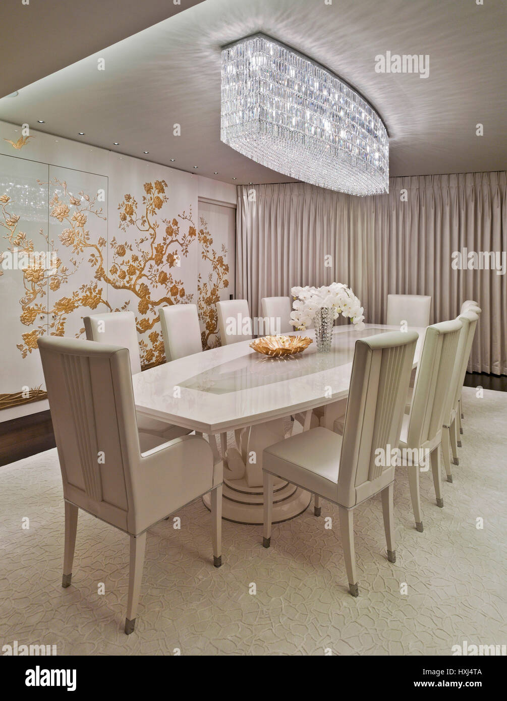 White-gold dining room in a luxury apartment in London Stock Photo