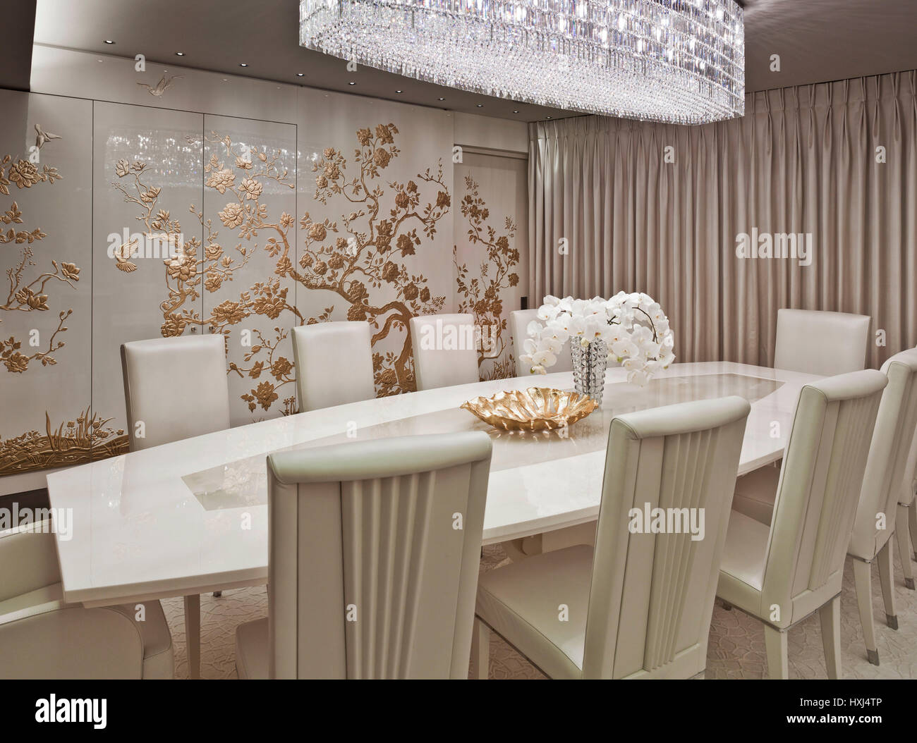 White-gold dining room in a luxury apartment in London Stock Photo