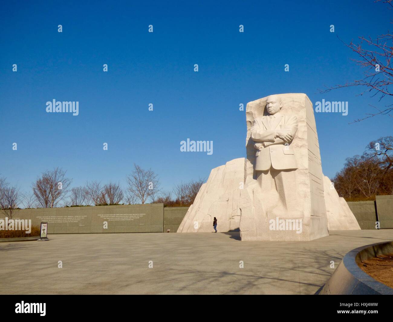 Martin Luther King Jr Memorial with single person, under crystal clear blue skies in early spring, Washington, DC, USA Stock Photo