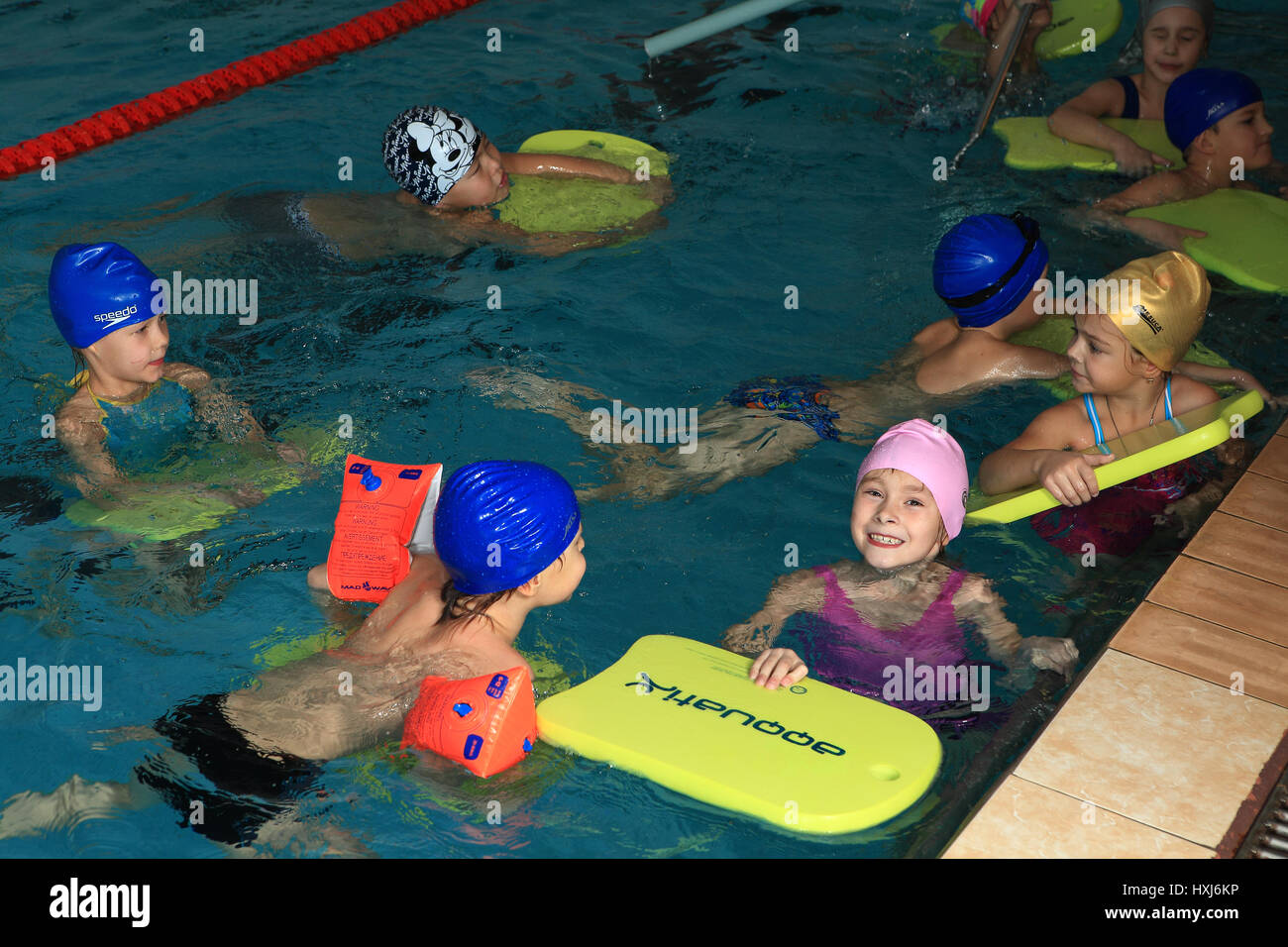 RUSSIAN FEDERATION, SAINT PETERSBURG - OCTOBER 24, 2013: Children 8 years  old, boys and girls learn to swim in lap pool. Illustration for Editorial  Us Stock Photo - Alamy
