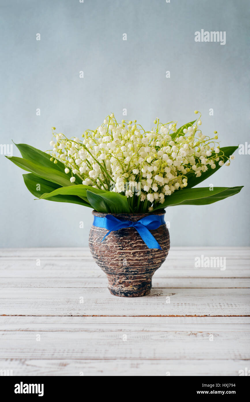 Lily valley in blue vase hi-res stock photography and images - Alamy