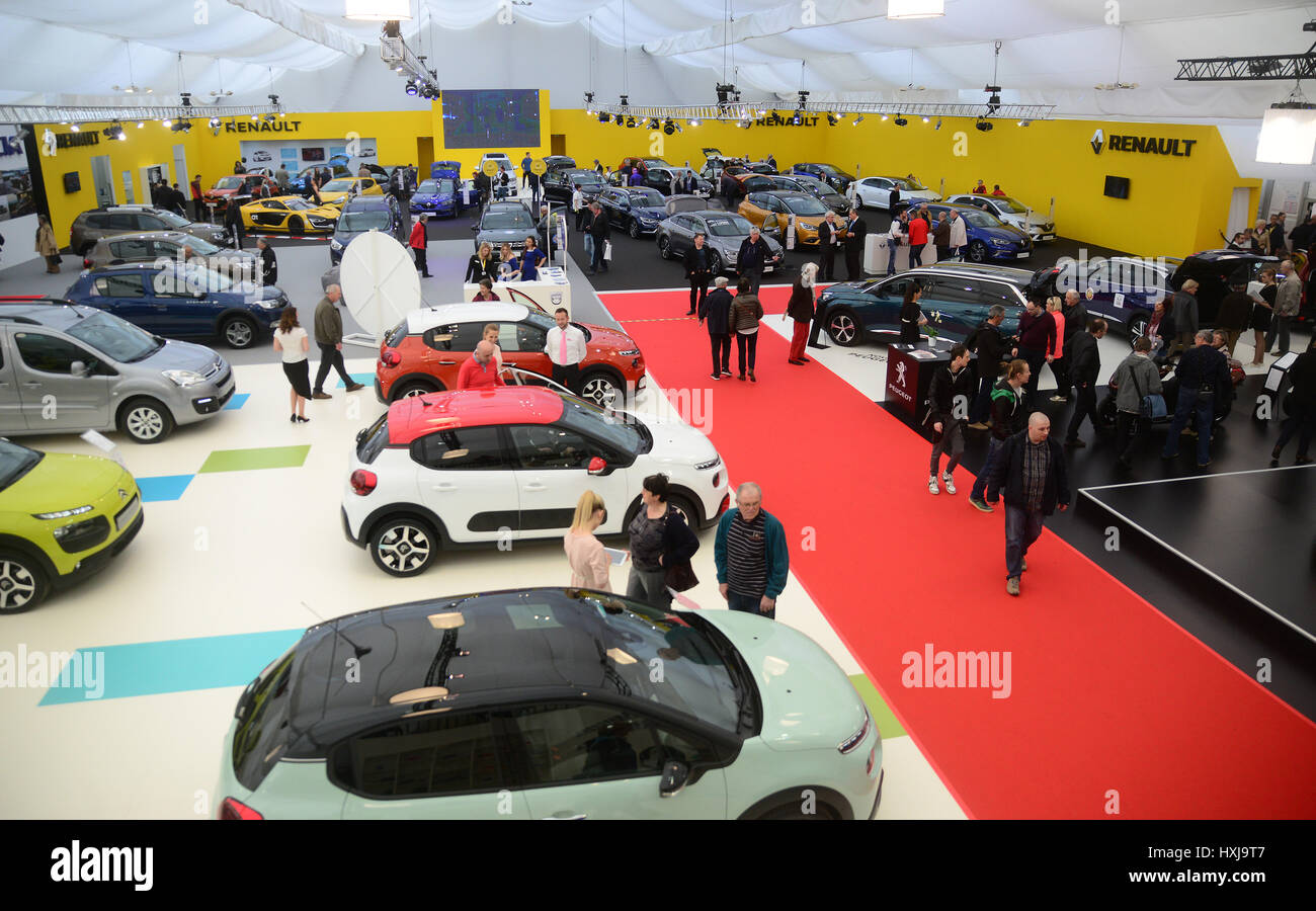 (170329) -- LJUBLJANA, March 29, 2017 (Xinhua) -- People are looking at the exhibited cars at 24th Slovenian Motor Show in the exhibition and convention centre (GR) in Ljubljana, Slovenia, March 28, 2017. The 24th Slovenian Motor Show, which is open to the public from March 27 to April 2, 2017, are exhibited on 12,000 square meters of exhibiton space with 260 vehicles. (XINHUA PHOTO/MATIC STOJS) Stock Photo