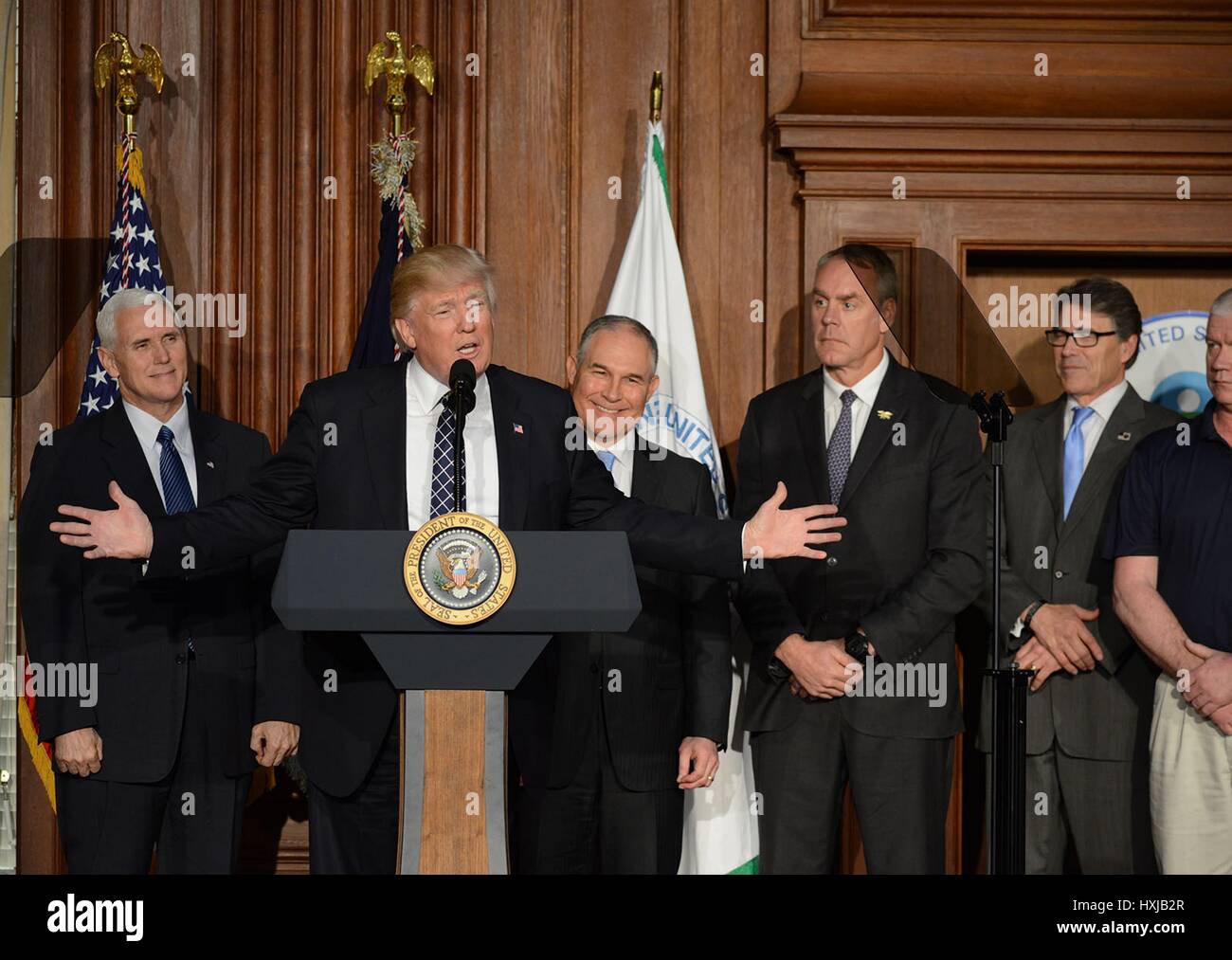 U.S. President Donald Trump smiles after signing the Energy Independence Executive Order at the Department of the Interior March 28, 2017 in Washington, DC. The order rolls back most of President Barack Obama's climate-change rules and environmental policies including the landmark Clean Power Plan. Stock Photo