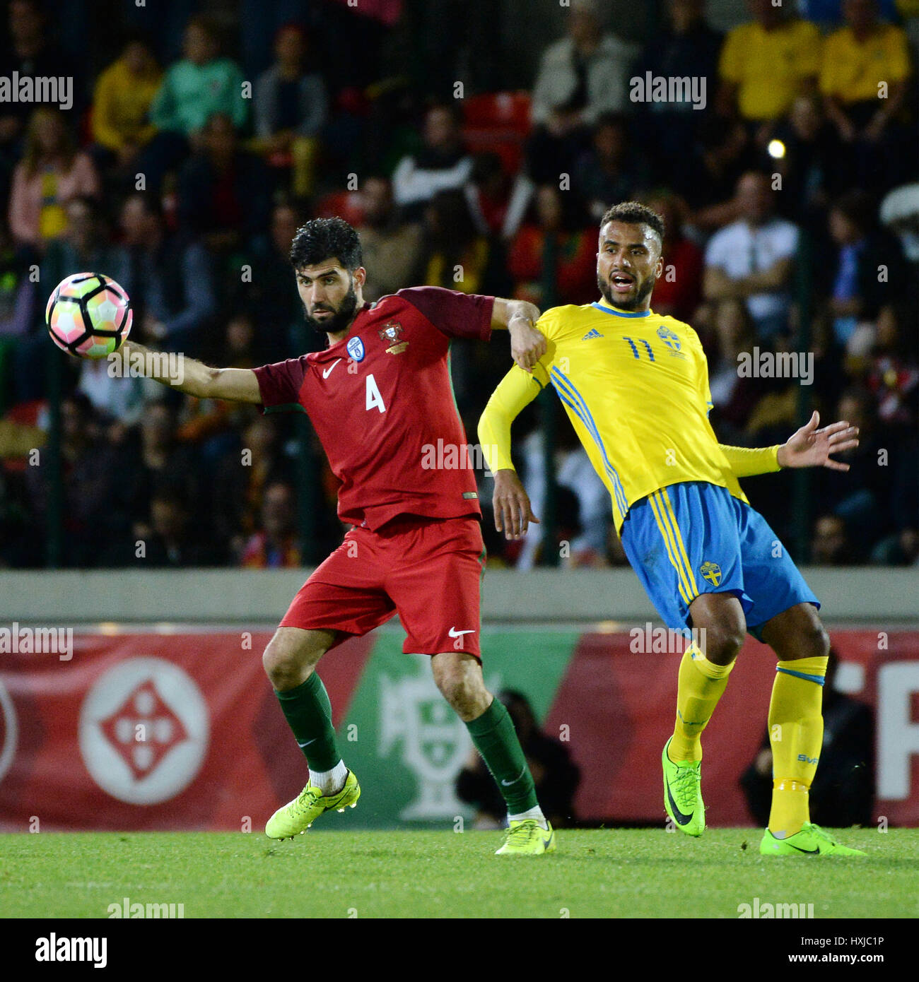 Funchal, Portugal. 28th Mar, 2017. Portugal's Luis Neto (L) vies with Kiese Thelin of Sweden during an international friendly soccer match between Portugal and Sweden at Barreiros Stadium in Funchal, Portugal, on March 28, 2017. Portugal lost 2-3. Credit: Joana Sousa/Xinhua/Alamy Live News Stock Photo