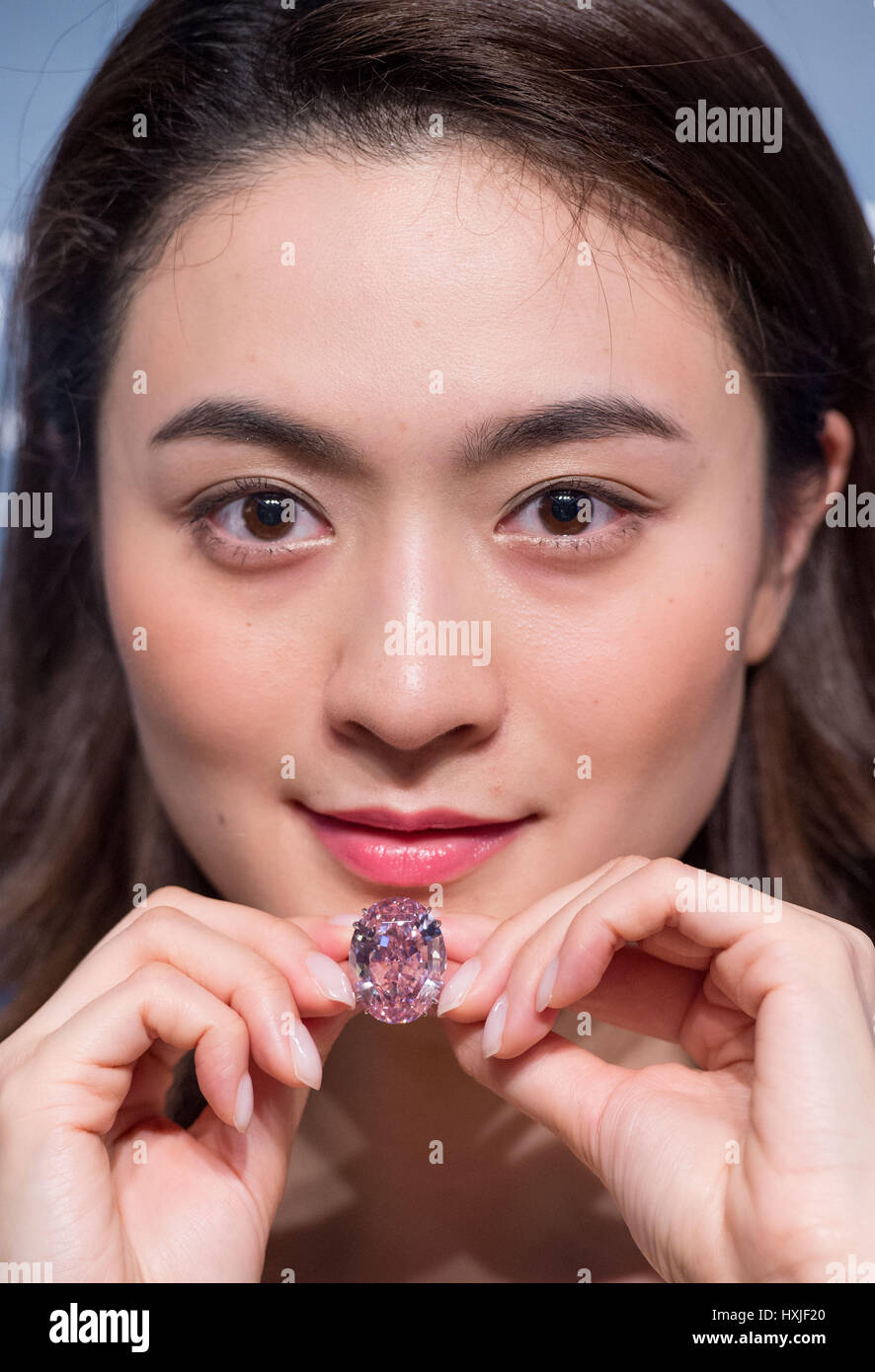 Hong Kong, Hong Kong SAR, China. 29th Mar, 2017. A model shows the 59.60 carat Pink Star diamond, expected to fetch US$60 million plus, to the press at Sotheby's auction house, Hong Kong.The Pink Star Diamond is extremely rare and is the largest internally flawless fancy vivid Pink Diamond ever graded by the GIA Credit: Jayne Russell/ZUMA Wire/Alamy Live News Stock Photo