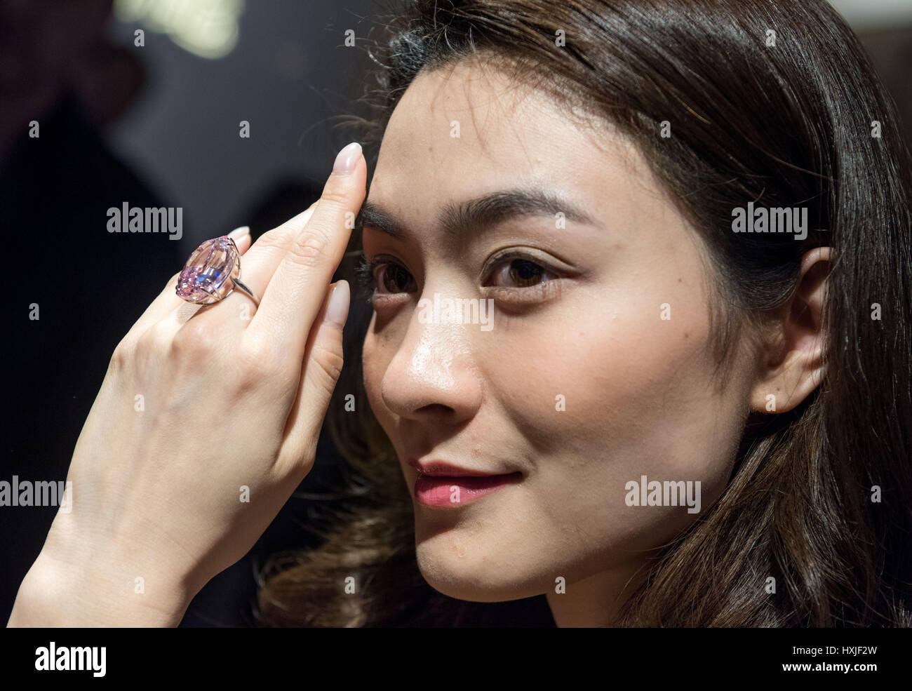 Hong Kong, Hong Kong SAR, China. 29th Mar, 2017. A model shows the 59.60 carat Pink Star diamond, expected to fetch US$60 million plus, to the press at Sotheby's auction house, Hong Kong.The Pink Star Diamond is extremely rare and is the largest internally flawless fancy vivid Pink Diamond ever graded by the GIA Credit: Jayne Russell/ZUMA Wire/Alamy Live News Stock Photo