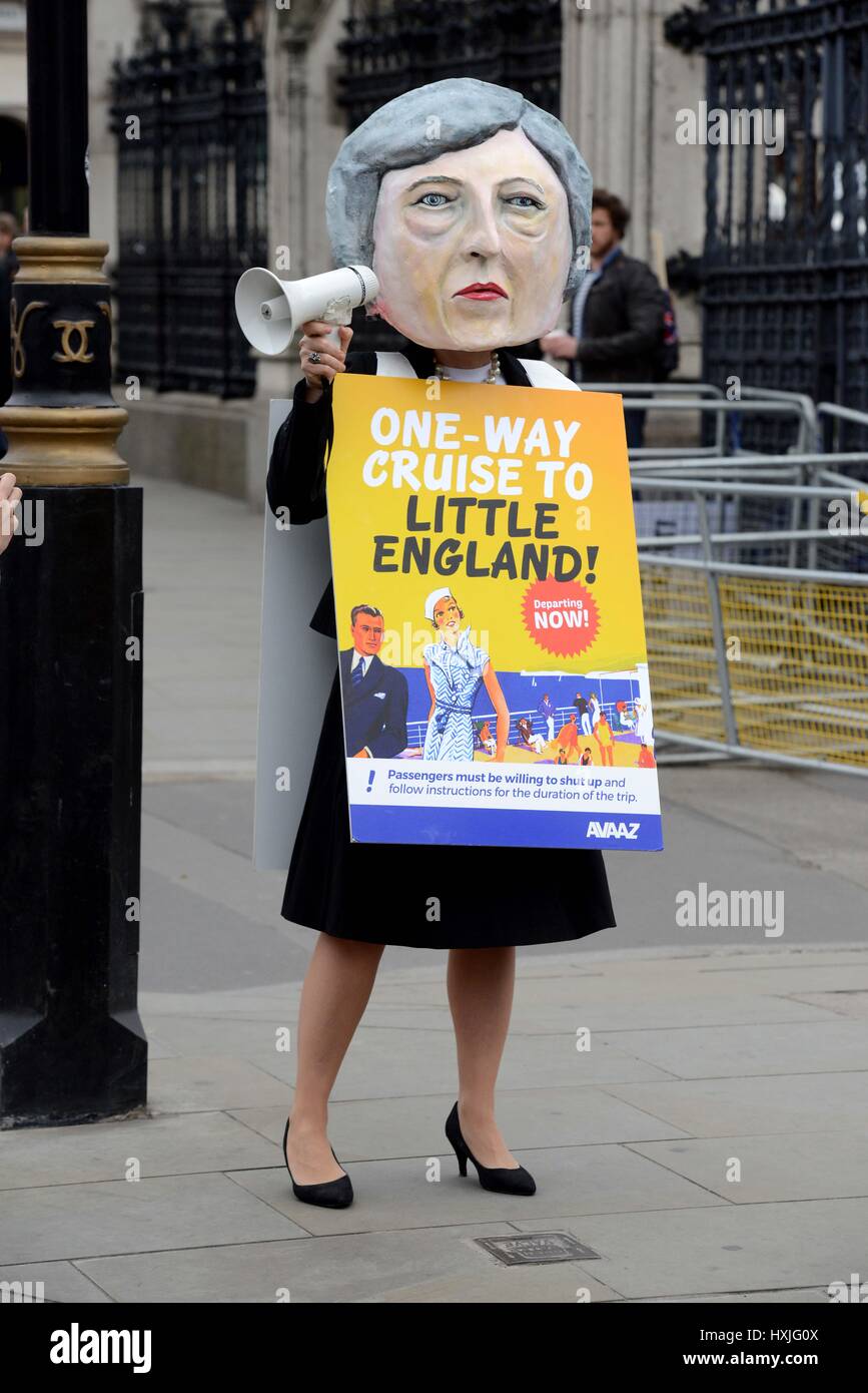 Protester dressed at Prime Minister Theresa May at Parliament after the triggering of Article 50, Westminster, London, UK Credit: Finnbarr Webster/Alamy Live News Stock Photo