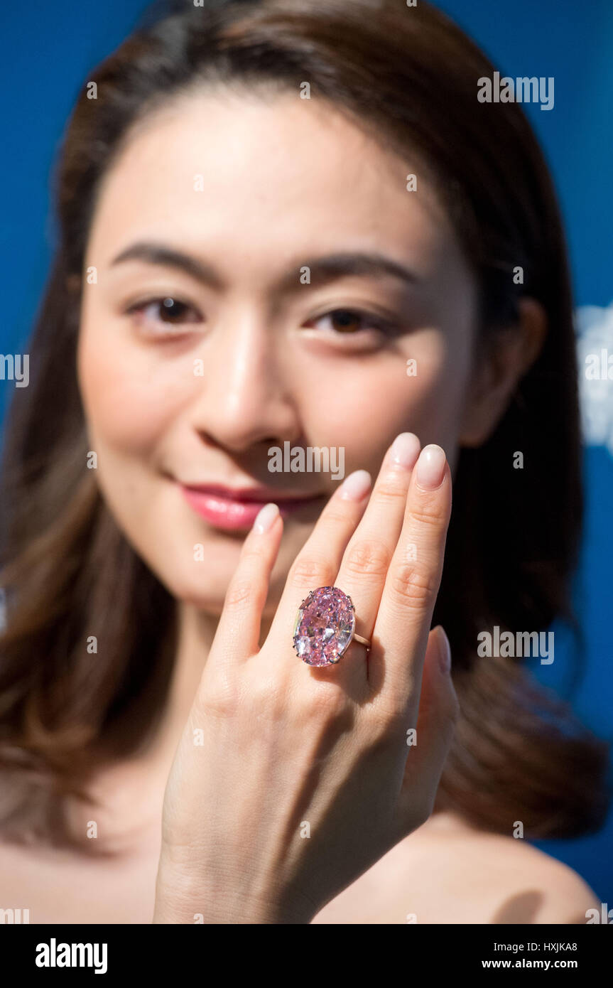 Hong Kong, China. 29th Mar, 2017. A model shows the 59.60 carat Pink Star diamond, expected to fetch US $60 million plus, to the press at Sotheby's auction house, Hong Kong. The Pink Star Diamond is extremely rare and is the largest internally flawless fancy vivid Pink Diamond ever graded by the GIA. Credit: Jayne Russell/ZUMA Wire/Alamy Live News Stock Photo
