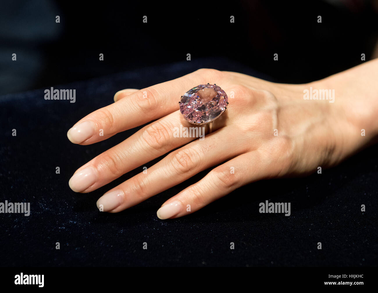 Hong Kong, SAR, China. 29th Mar, 2017. A model shows the 59.60 carat Pink Star diamond, expected to fetch US$60 million plus, to the press at Sotheby's auction house, Hong Kong.The Pink Star Diamond is extremely rare and is the largest internally flawless fancy vivid Pink Diamond ever graded by the GIA Credit: Jayne Russell/ZUMA Wire/Alamy Live News Stock Photo