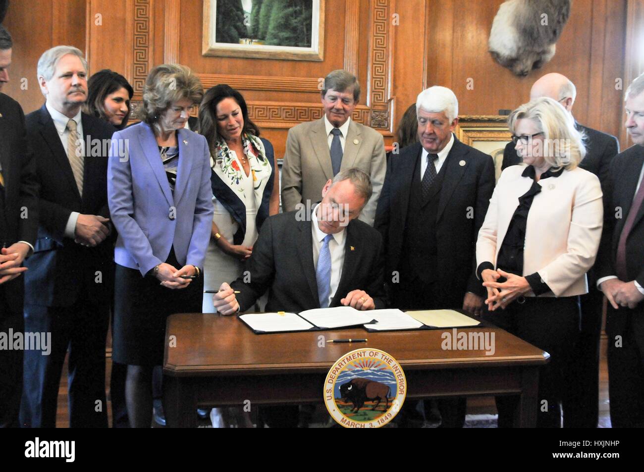 Washington, USA. 29th March 2017. U.S. Interior Secretary Ryan Zinke, accompanied by Republican members of Congress, signs an order lifting a moratorium on new coal leases on federal lands during a ceremony at the Interior Department March 29, 2017 in Washington. Credit: Planetpix/Alamy Live News Stock Photo