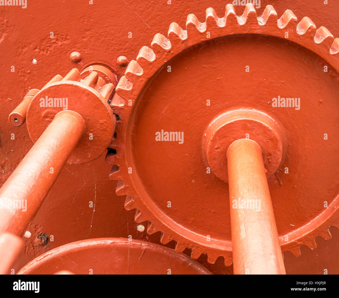 Close up of iron cogs of old dockside harbour mechanism with cog wheels and rods Stock Photo