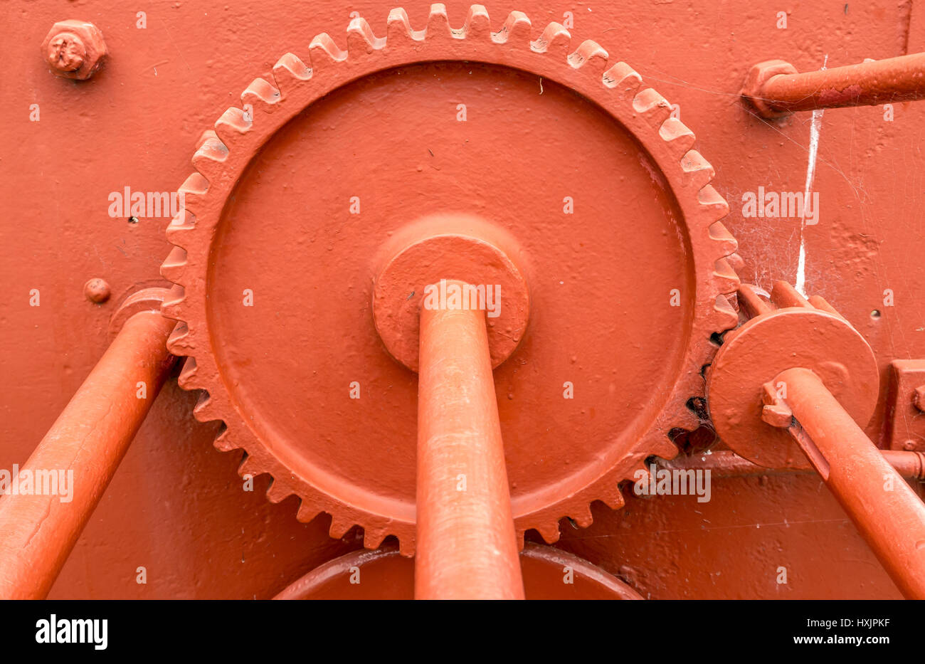 Close up of iron cogs of old dockside harbour mechanism with cog wheels and rods Stock Photo