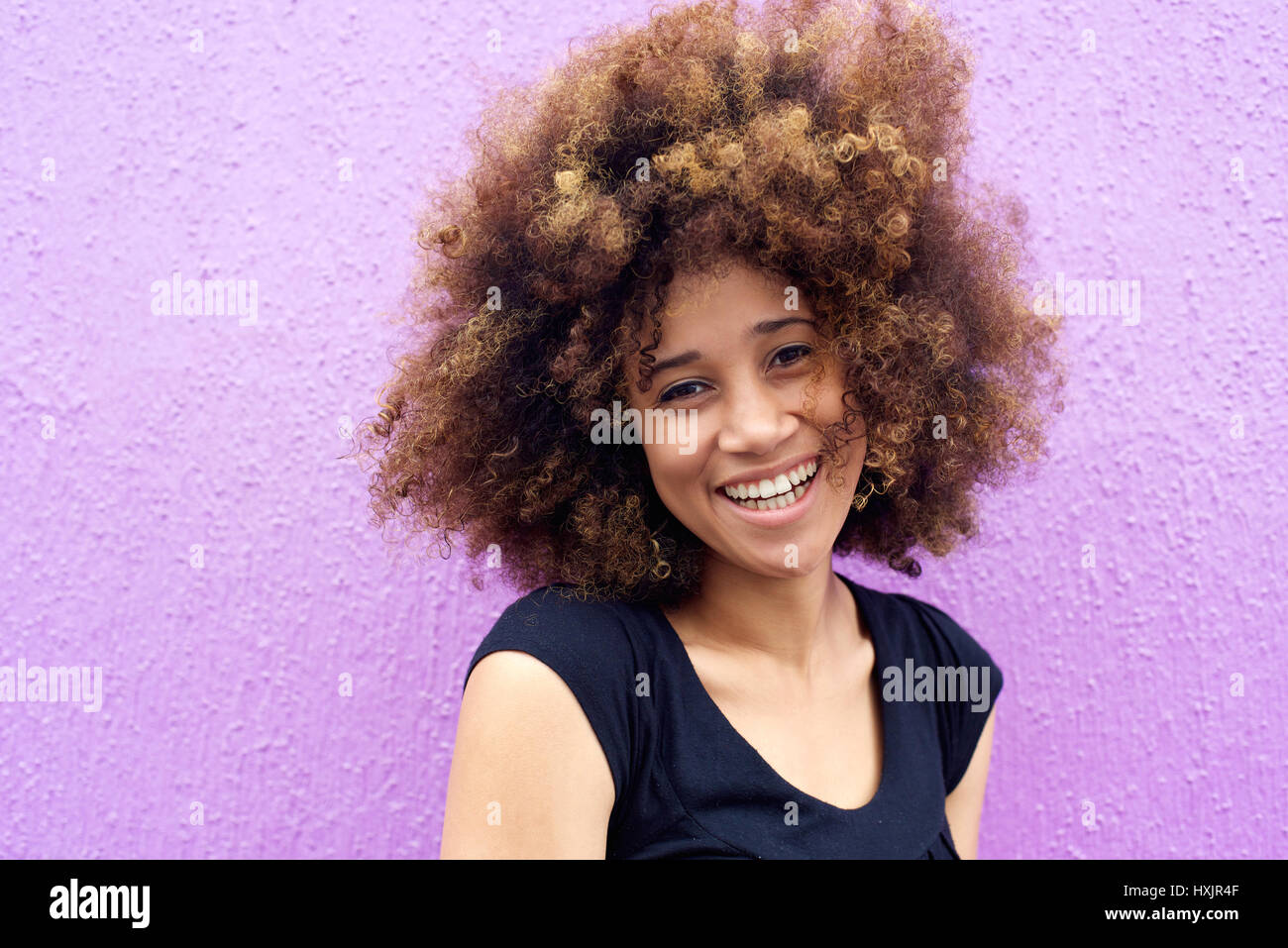Close up portrait of a laughing african american woman with afro Stock ...