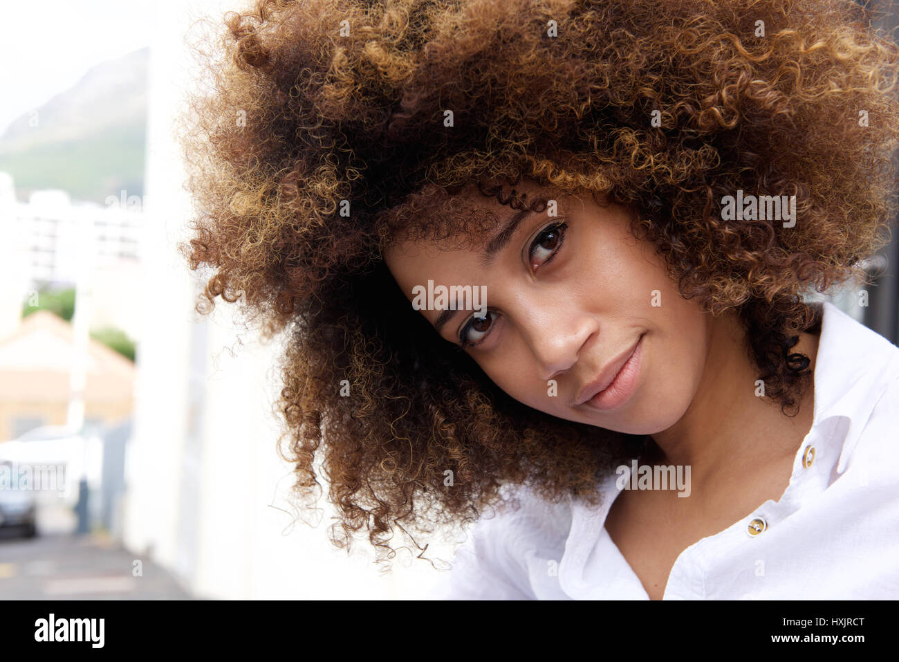 Close up portrait of a beautiful young african american woman with afro ...