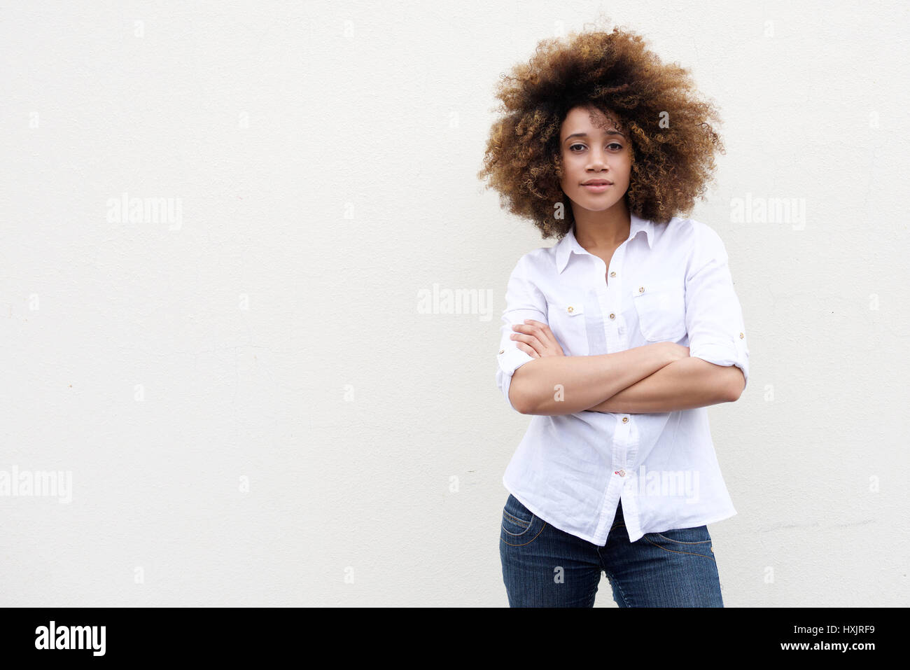 Portrait of a cool young african american woman with curly hair ...