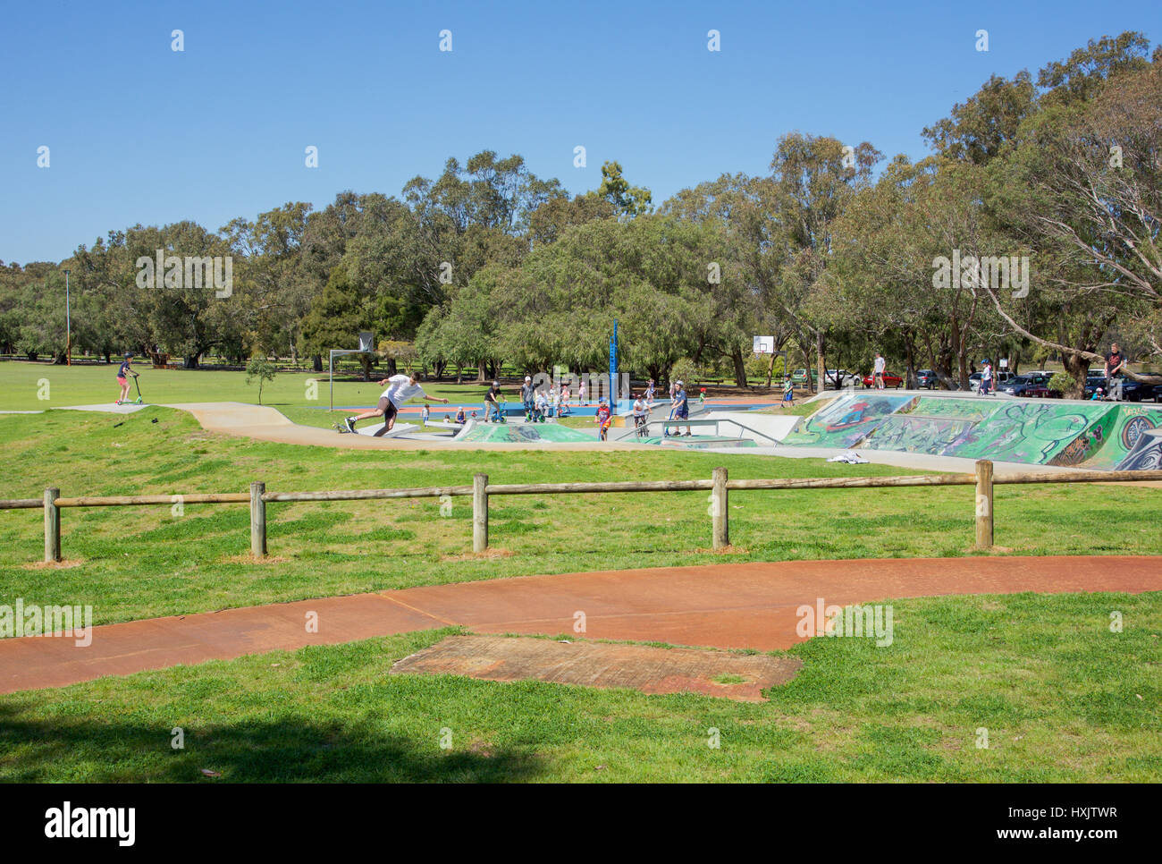 City Beach,WA,Australia-October 5,2016:People at a City Beach skatepark on skateboards and scooters surrounded by natural reserve in Western Australia Stock Photo