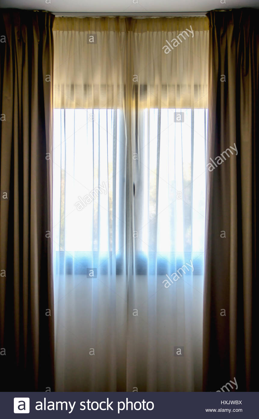 Translucent Curtains Hung On A Window Drapes Are Used To Decorate