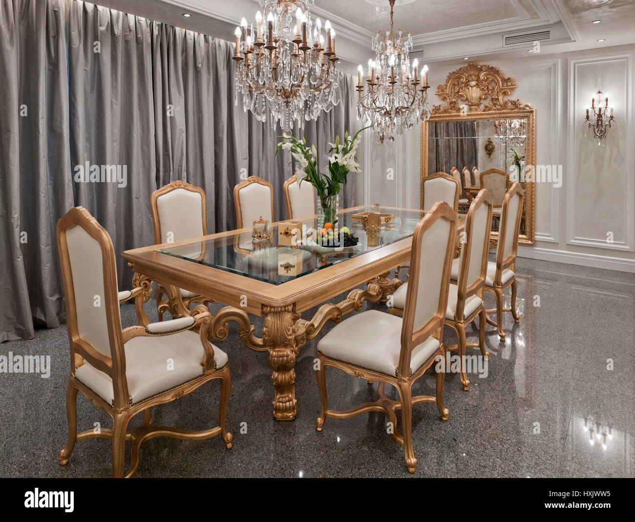 Luxury show-room interior, dining room, dining decorated table, classic style, gold coloured dining hall, moscow Stock Photo