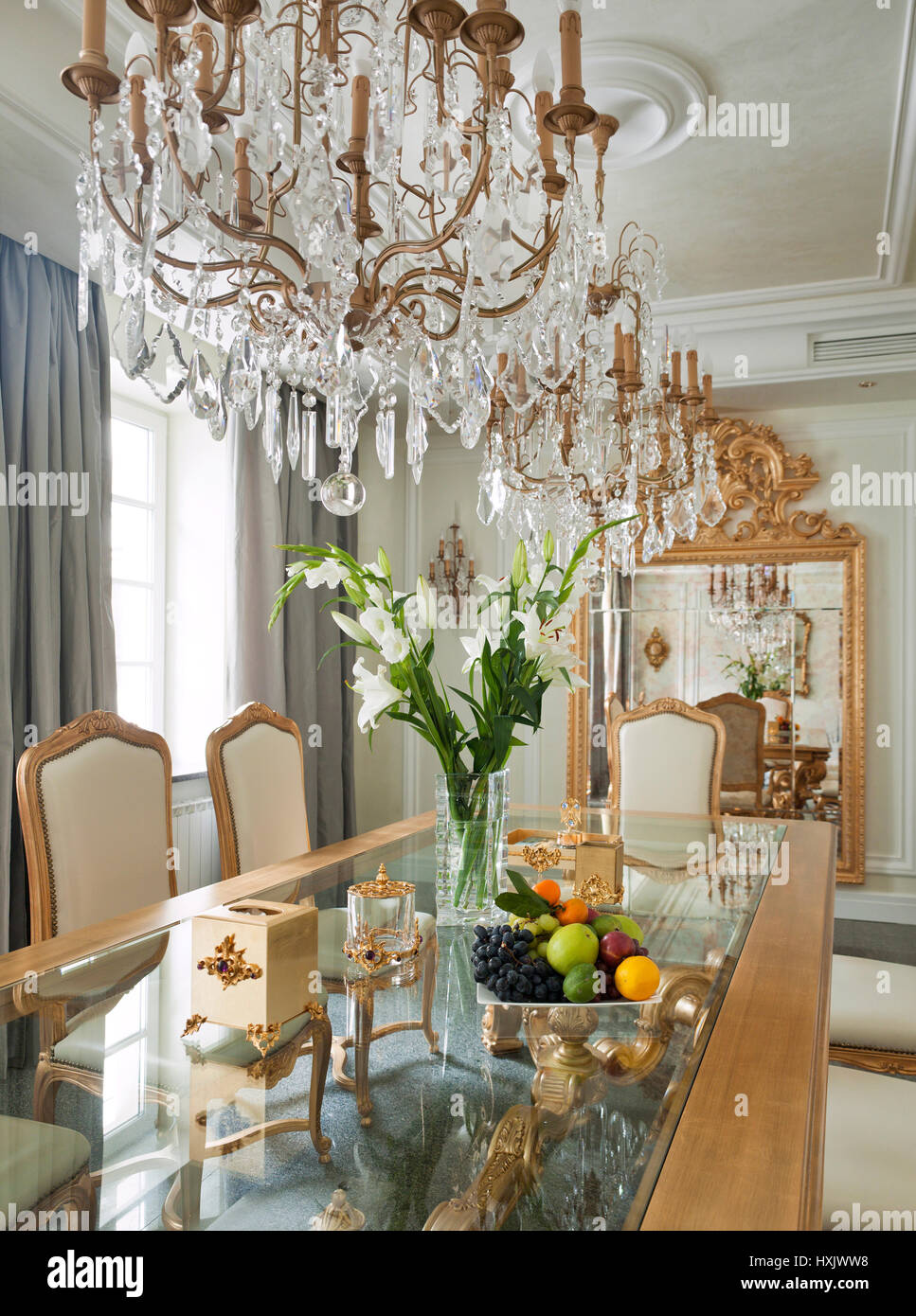 Luxury show-room interior, dining room, dining decorated table, classic style, gold coloured dining hall, moscow Stock Photo